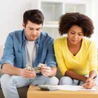 man and woman budgeting