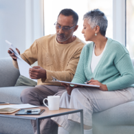 senior man and woman checking paper