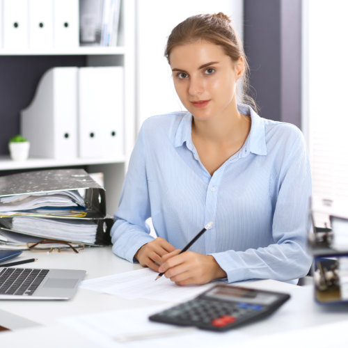 Woman bookkeeper or financial inspector calculating