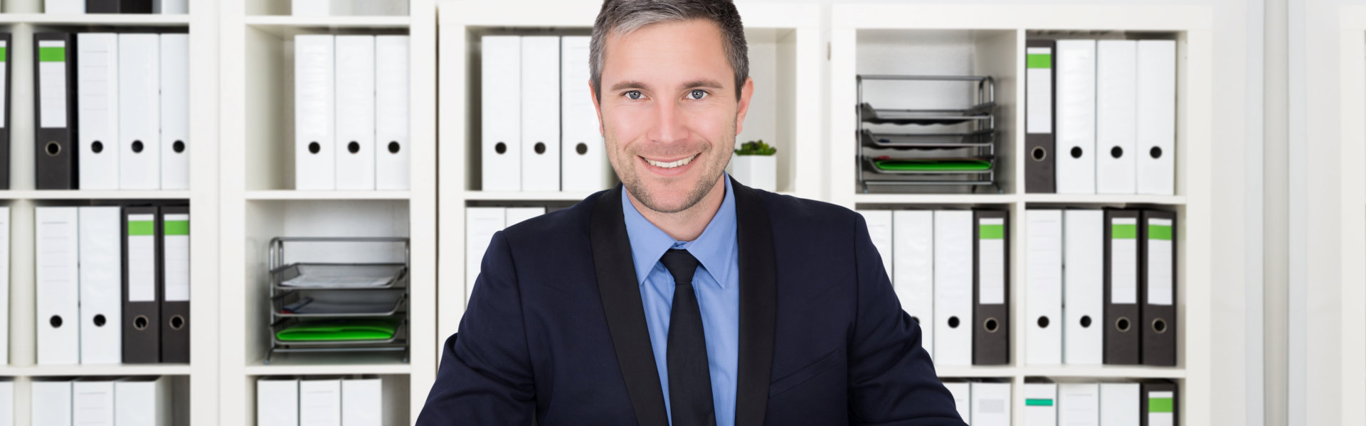 man in tuxedo smiling